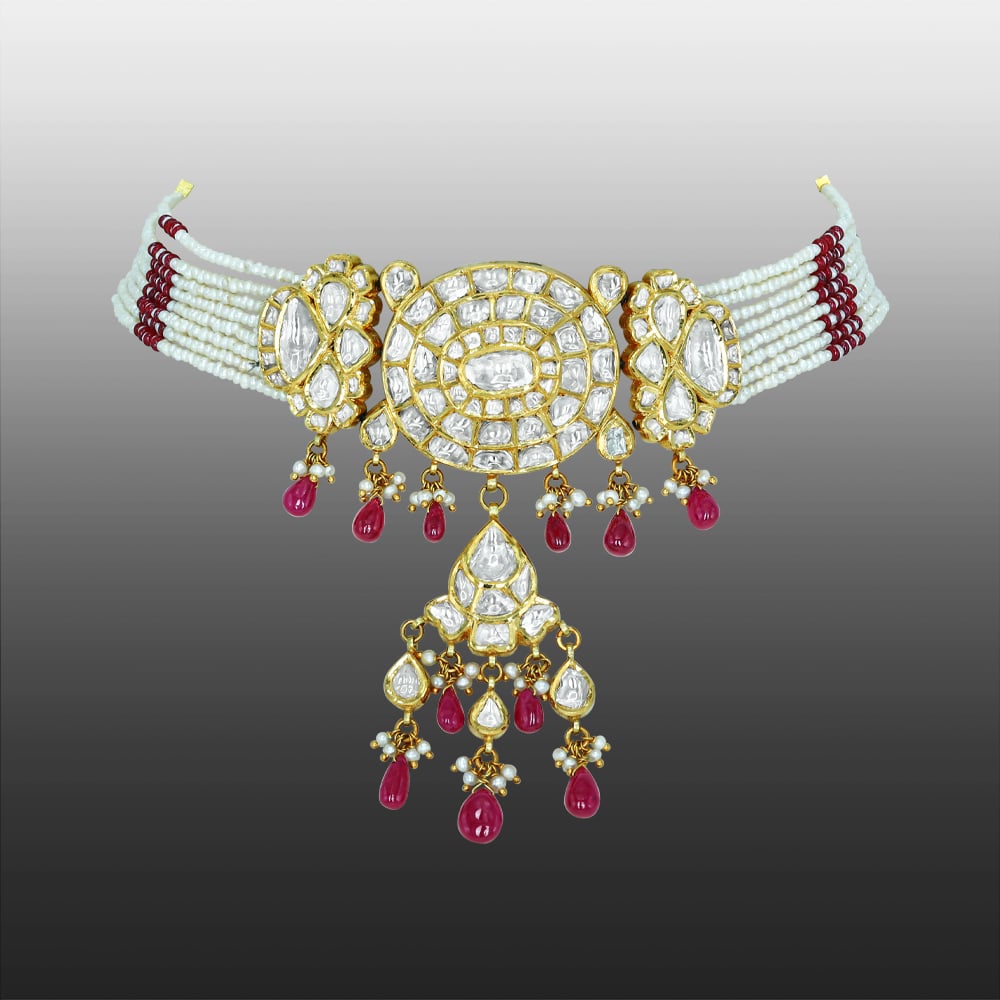 Oval Polki Choker with Floral Motifs, Ruby Drops, and Pearl Accents